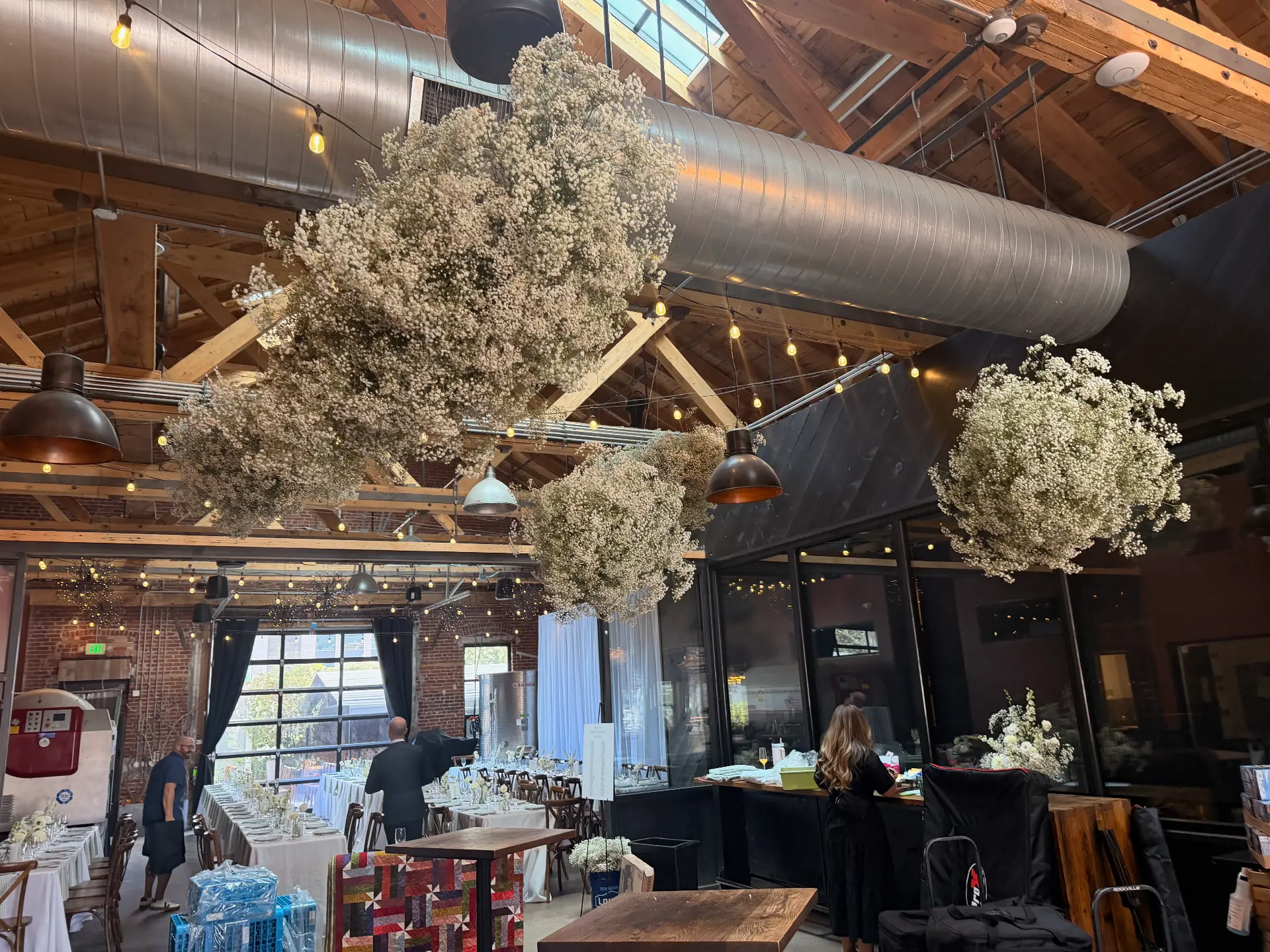 Clouds of baby’s breath hung above the reception hall